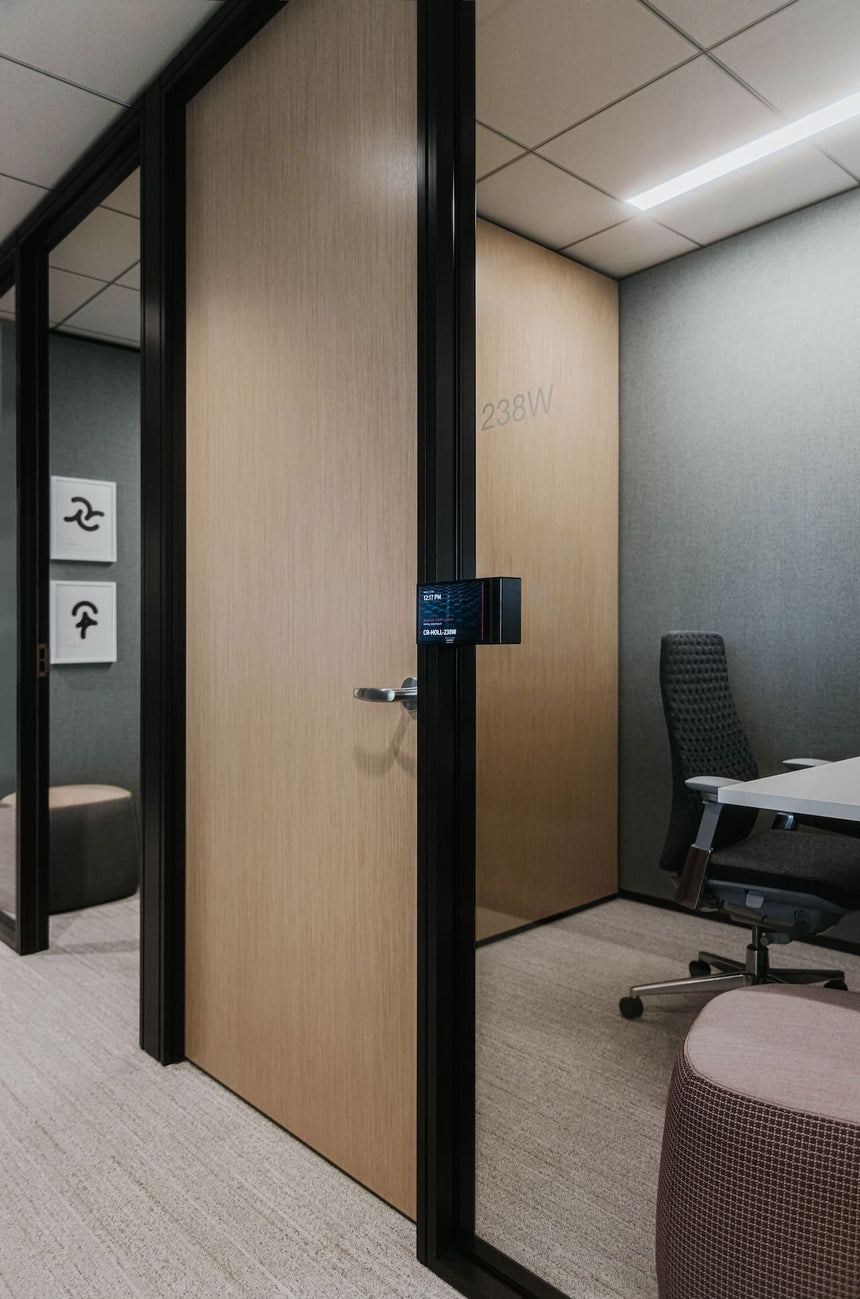 Modern office interior with a glass partitioned office space.