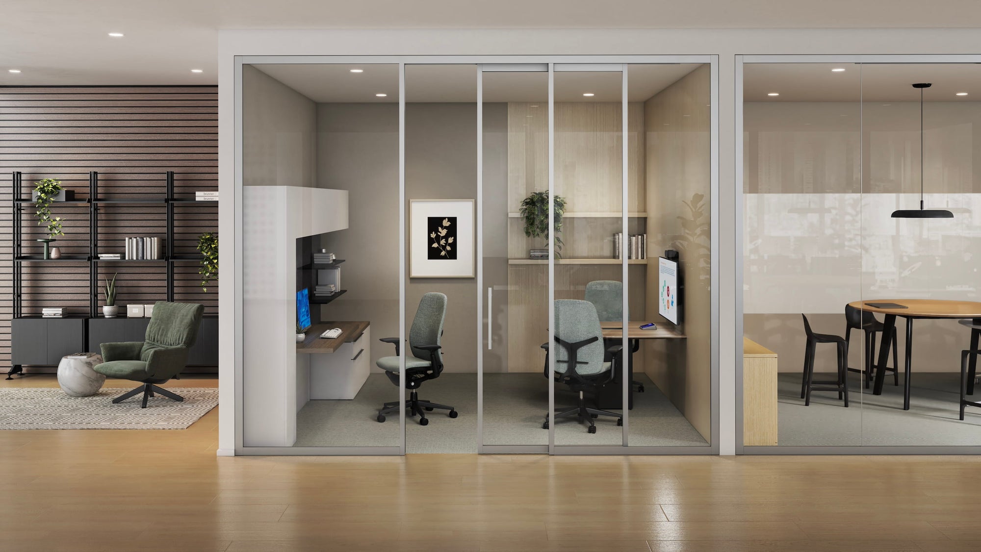 Modern office interior with glass partitioned office space, chairs, and a desk.