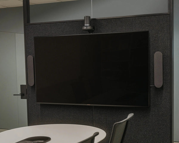 Conference room with a large screen and chairs