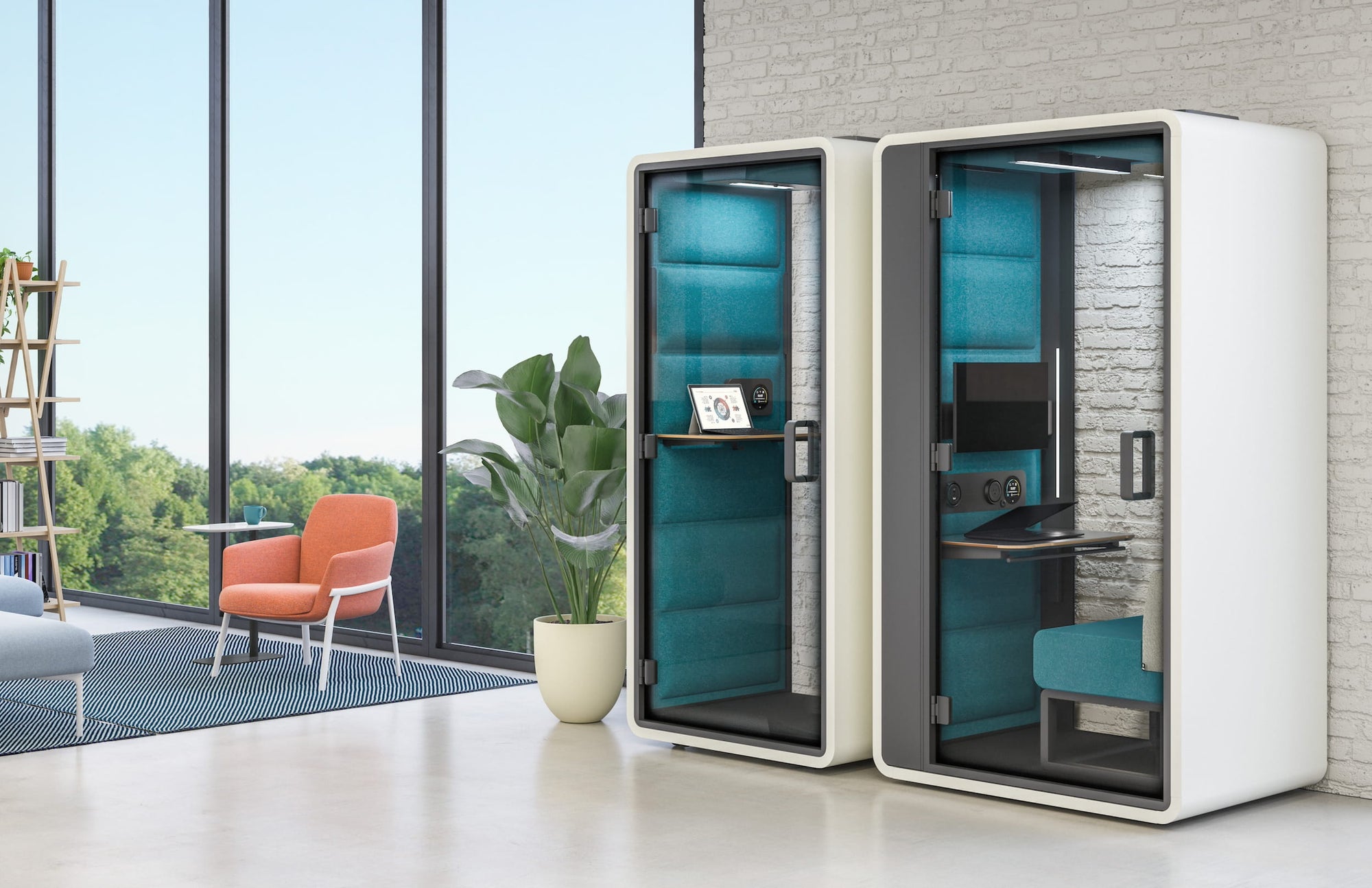 Modern office pod with glass walls in a bright room with large windows.