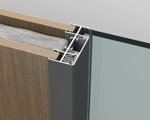 Close-up of a wooden panel with metal trim and glass surface on a gray background